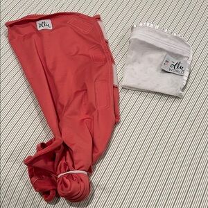Ollie swaddle with mesh wash bag.